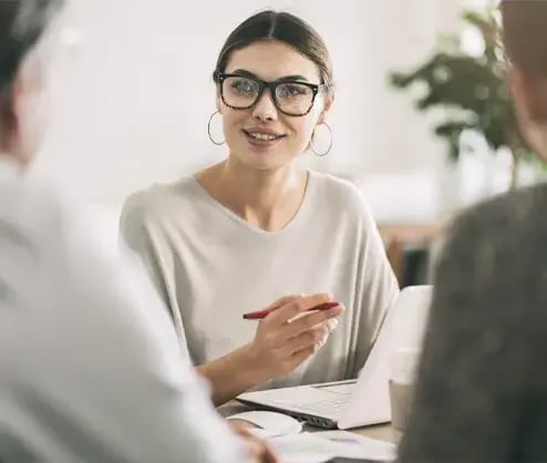 Woman is talking with clients about safeguarding their business