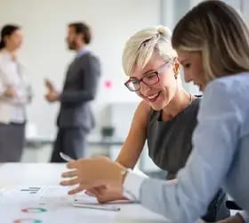 Person getting interviewed for a Job at a desk