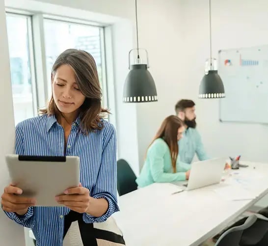 Business woman views SAP Business Technology Platform (BTP) on her tablet, learning how to Automate and Extend her business