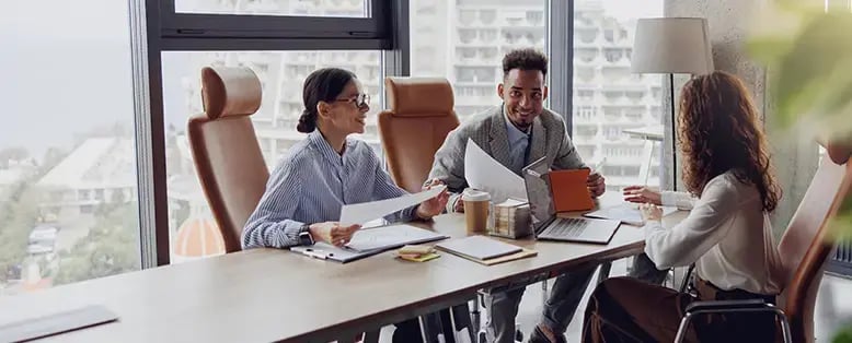 People in the office reviewing SAP Business One research hub