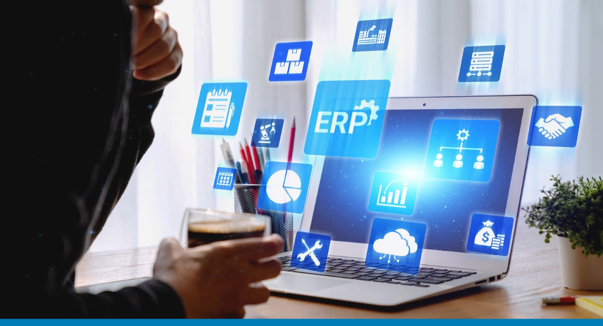 icons representing business management, finance, analytics, inventory and cloud services, that is all part of cloud based ERP, floating above a laptop