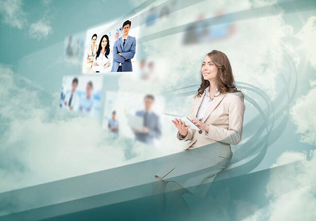 Smiling businesswoman manipulates a tablet that projects images of employment recruitment into the air