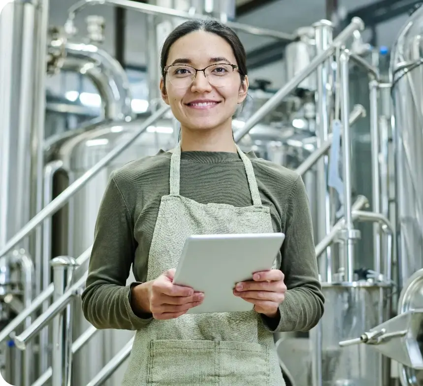 Lady with her tablet with brewery software to help manage her brewery